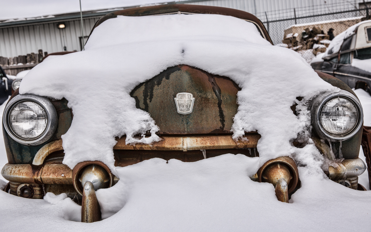 old truck front covered in snow and ice